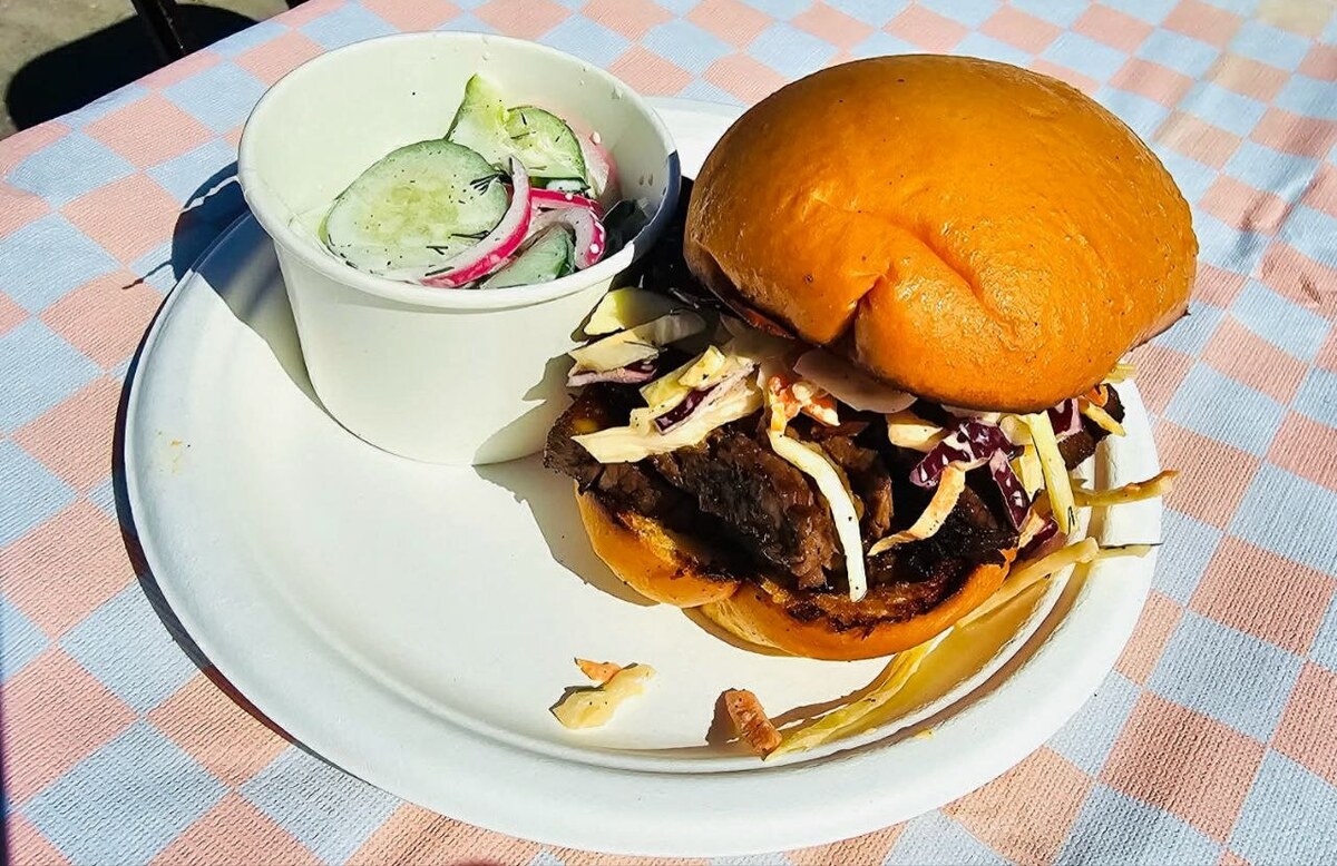 Beef brisket sandwich with slaw and pickled cucumbers